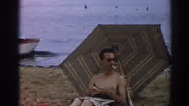 New Jersey USA (1963): Man Smoking On Beach