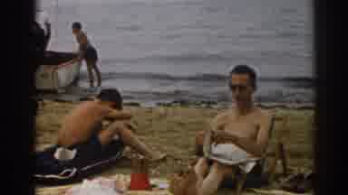 New Jersey USA (1963): Old Film Showing People On The Beach Reading Newspaper And