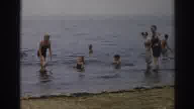 New Jersey USA (1963): Families Get Together To Have Fun In The Water On A Gloomy