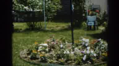 New Jersey USA (1963): A Women Sitting In A Backyard Enjoying A Drink In The Sun