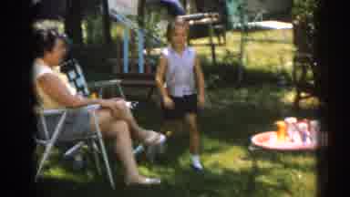 New Jersey USA (1963): Little Girl Stands Up Then Skips Off Camera As Two People