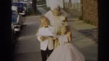 New Jersey USA (1963): Woman Wearing Blue Dress And Girl Wearing Red Dress Leave A