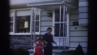 New Jersey USA (1963): A Mother Stepping Out Of The House With Her Daughter