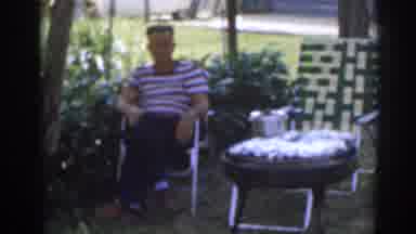 New Jersey USA (1963): Man Sits Calmly In Lawn Chair Along With A Little Girl And
