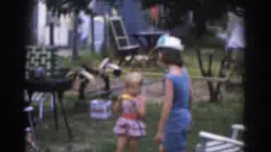 New Jersey USA (1963): Little Girl Eating Corn With Loving Big Sister