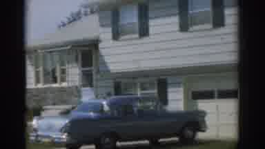 New Jersey USA (1963): Man Walking Besides Car Parked In Front Of Big House