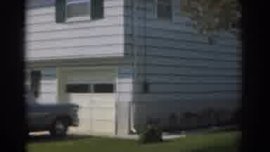 New Jersey USA (1963): View Of Grey Car Parked In Front Of A White House On A