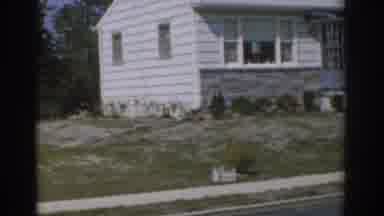 New Jersey USA (1963): Front Of A Small White Panel House That Has Grey Brick