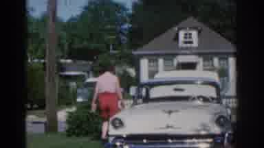 New Jersey USA (1963): Woman Wearing Pink Shirt And Red Shorts Taking Care Of