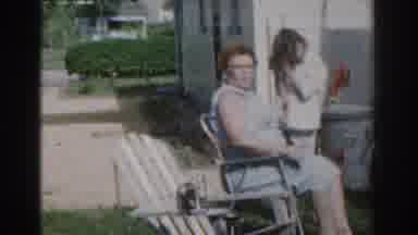 New Jersey USA (1963): Family Styling Hair In Their Yard At Home