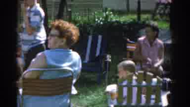 New Jersey USA (1963): Group Of People Gathered In A Garden During The Day