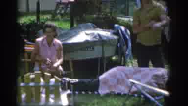 New Jersey USA (1963): Summer Garden Scene With Lady Sat Down In Chair A Person On