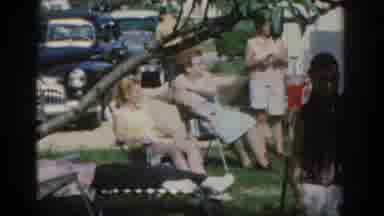 New Jersey USA (1963): Some Families Are Gathered In A Garden Under The Sun