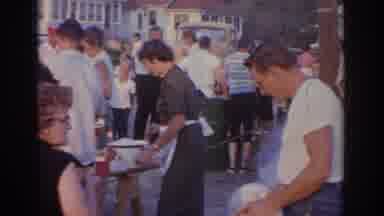 New Jersey USA (1963): Group Of Men And Women At A Barbecue Cookout Eating