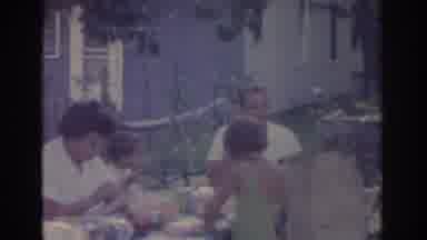 New Jersey USA (1963): Parents And Two Children Enjoy A Meal Outdoors In The