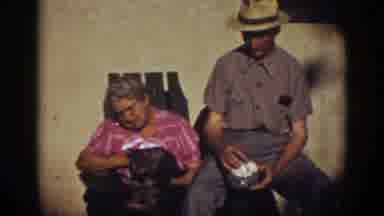 Auburn California-1939: Old Couple Sitting with Cat and Eggs