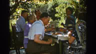 Auburn California (1939): Old Black Man Sitting On A Table In A Park Getting Ready