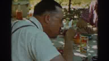 Auburn California (1939): Man Eating Food At A Table In The Outdoors With Someone