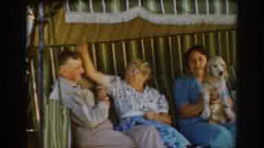 Auburn California (1939): Three People Sitting In A Swinging Couch Playing With