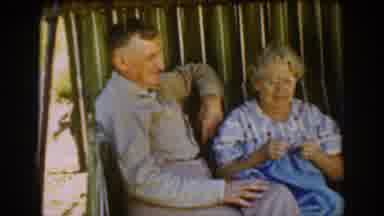 Auburn California (1939): Three People Sit On Outside Chair With A Dog Who Walks