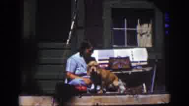 Lake Tahoe California (1939): Lady Drying A Dog Outside
