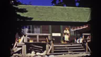 Lake Tahoe California (1939): Woman At The Cottage With A Happy Dog