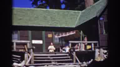 Lake Tahoe California (1939): Woman And Dog Playing On The Porch Of Campground