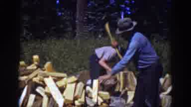 Lake Tahoe California (1939): Boy Wearing White Shirt Helps Man Wearing Blue Shirt