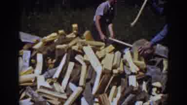Lake Tahoe California (1939): Couple Of People Cutting Wood Tree Pile And Throwing