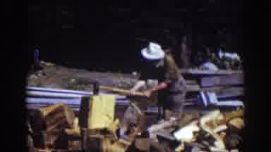 Lake Tahoe California (1939): Man In White Hat Wielding Ax Chopping Wood Standing