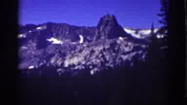 Lake Tahoe California (1939): A View Of Mountains Partially Covered In Snow With