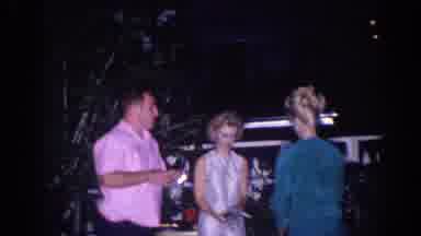 El Monte California (1966): Man Wearing Pink Shirt Sits Down In Black Chair As Man