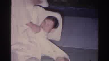 El Monte California (1966): Two Males In White Martial Arts Outfit Wrestling One