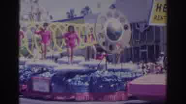 Norfolk Virginia (1966): Women In Pink Costumes Stand On The Parade Float And Wave