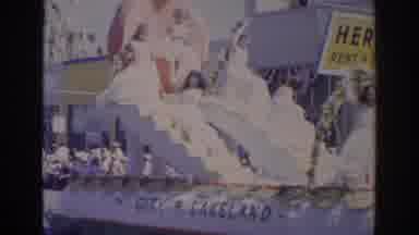Norfolk Virginia (1966): A Giant Float With People On It Moving Down A Street With