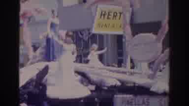Norfolk Virginia (1966): Six Women Wearing White Dresses Wave From White Parade