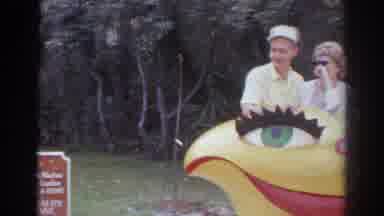 Norfolk Virginia (1966): Three People Standing Behind Yellow Smiley Face Sculpture
