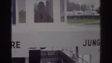 Norfolk Virginia (1966): A Man At A Jungle Cruise Station Watches A Large Boat