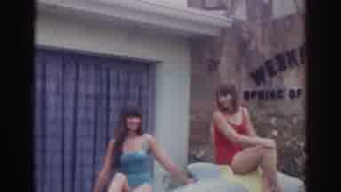 Norfolk Virginia (1966): Two Girls In Bathing Suits Sit In Front Of Sign Which