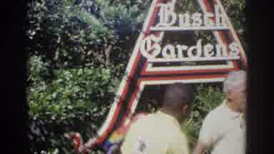Norfolk Virginia (1966): Man Wearing White Shirt Stands In Front Of Busch Gardens