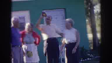 Norfolk Virginia (1966): A Man Among Older Adults Drinks Tomato Ketchup From The