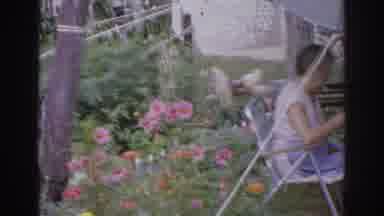 Norfolk Virginia (1966): A Well-Flowered Garden And A Lady Sitting On A Chair