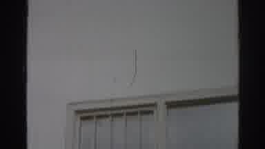 San Gabriel California (1966): The Exterior And Windows Of A White Building With A