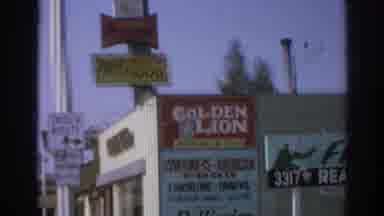 San Gabriel California (1966): Scaling A Store's Signs On The Corner Of A Street