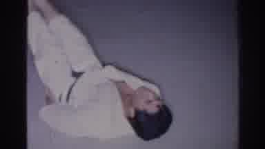 San Gabriel California (1966): Men Lying On Back Performing Exercises Dressed In