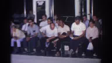 San Gabriel California (1966): Group Of Men Sitting Watching Something Off Camera