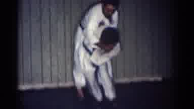 SAN GABRIEL CALIFORNIA-1966: Karate Black Belts Practice Throw In Dojo