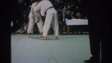 San Gabriel California (1966): Two Men Sparring In A Karate Match With A Referee