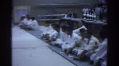 Temple City California (1966): Men Wearing Karate Uniforms Sitting On Green Mats