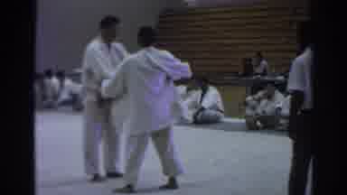 Temple City California (1966): Judo Wrestlers Hold Each Other By The Arm As They